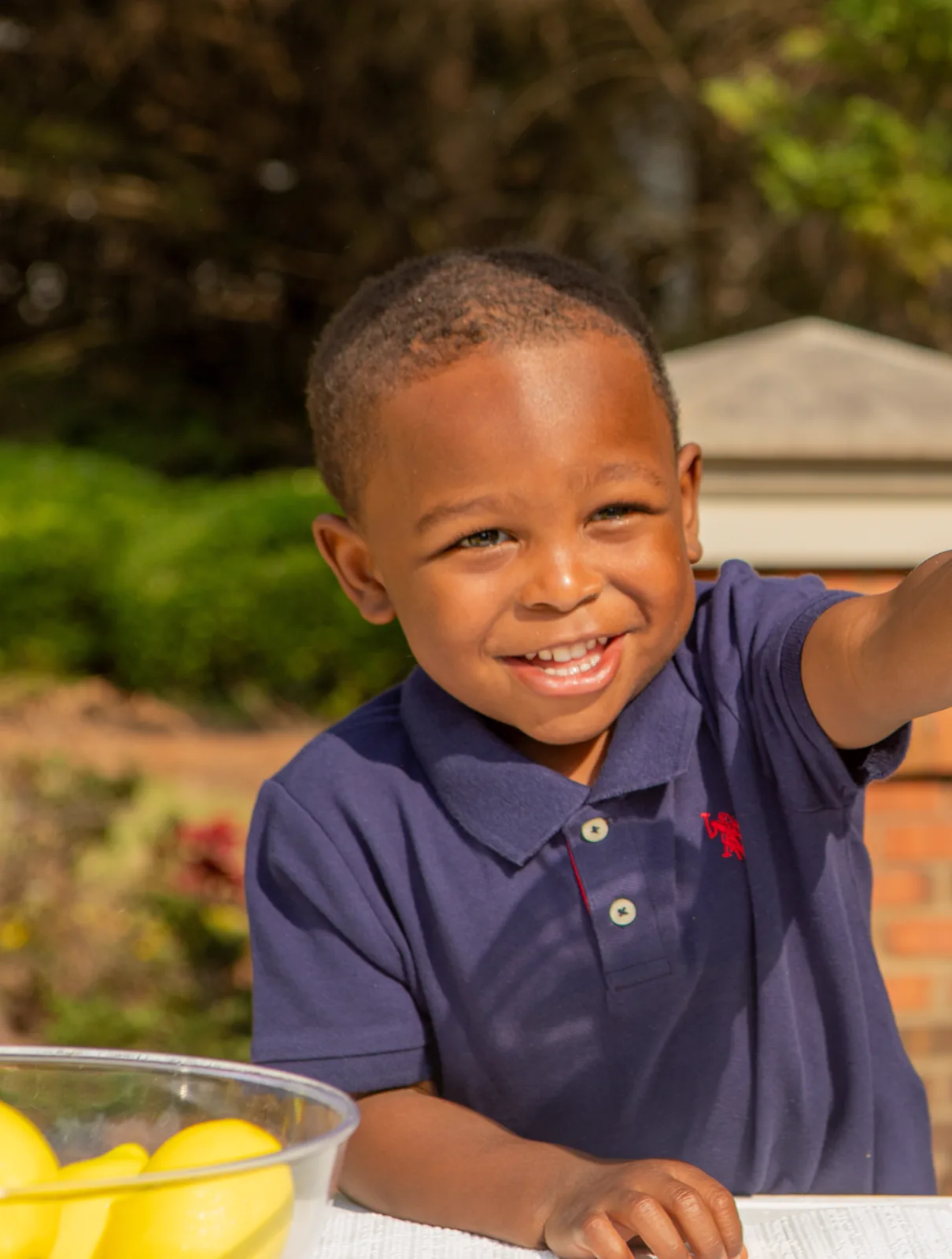 Jackson smiling at the lemonade stand